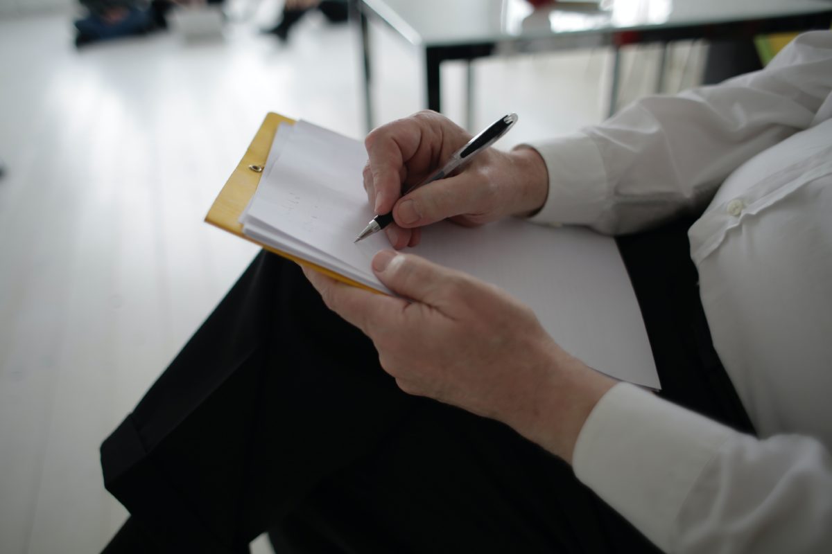 woman taking notes